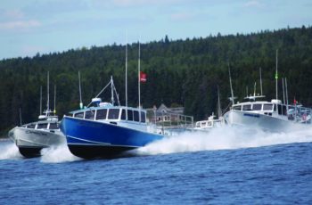 Win a boat at Winter Harbor lobster boat races The Winter Harbor 2018 lobster boat races. The event this weekend features a brand new Mitchell Cove 35 bare hull in a prize drawing. Jon Johansen photo.