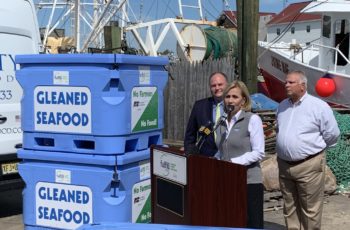 Gleaned Seafood brings bycatch to the needy Kim Guadagno, CEO of the Fulfill food bank, talks about her group's effort with America's Gleaned Seafood as fisherman Brick Wenzel, left, and PointPleasant Beach, N.J. Mayor Stephen Reid listen. Kirk Moore photo