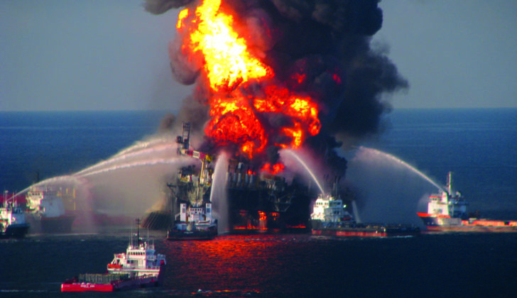 Ten years after Deepwater Horizon, the pain remains Offshore service vessels converge on the burning Deepwater Horizon in April 2010. Coast Guard photo.